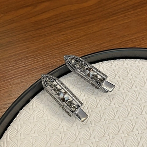 Detail of luxury beaded crystal hair clips with silver base and dark gray rhinestones