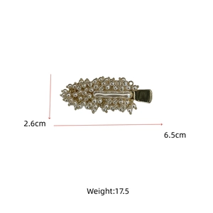 Detail view of crystal beaded hair clip showing dimensions 6.5cm length and 2.6cm width
