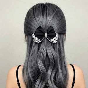 Elegant black ribbon bow hair clip with crystal rhinestones for a sophisticated ponytail