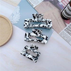 Three-piece set of elegant black and white marble acetate hair claws in various sizes