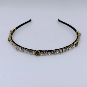 Detail of vintage French style headband with rhinestones and crystal beads on white background