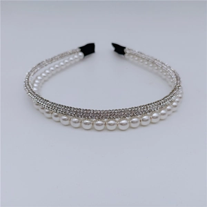 Close-up of double-layered headband with white rhinestones and elegant faux pearls