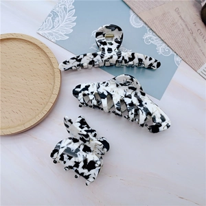 Three-piece set of elegant black and white marble patterned acetate hair claws for women