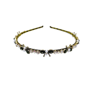 Vintage metal headband with green rhinestones, white pearls and butterfly bow accents