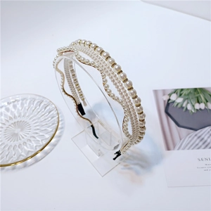 Elegant multi-layer pearl headband with rhinestones on a gold metal frame for women
