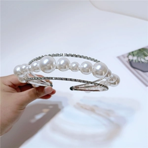 Detailed view of luxury multi-layer headband with pearls and sparkling rhinestones