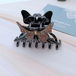 Elegant black acrylic butterfly hair claw clip with champagne rhinestones for women