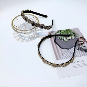 French vintage style headband set with gold clock-inspired metal relief ornaments