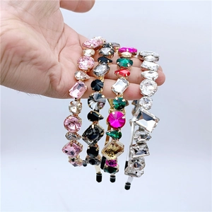 Detail of luxury rhinestone headband set with colorful geometric crystals and rubber tips
