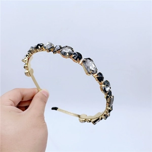 Detailed view of vintage gold headband with gray and clear luxury crystal rhinestones