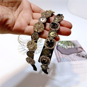 Detailed view of vintage baroque headbands with clock charms and crystal accents