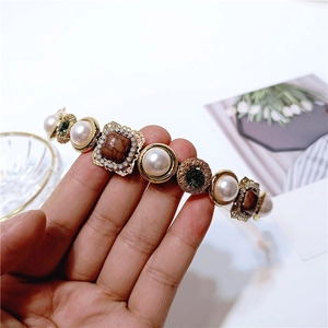 Vintage baroque headband with pearls, brown gemstones, and green crystals in gold filigree