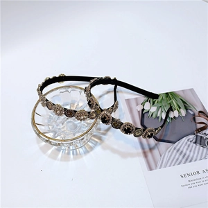 Close-up of French vintage headbands featuring crystal clock dials and black gemstones