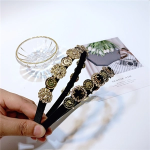 Detailed macro view of vintage clock dial and crystals on French style headband