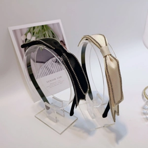 Elegant satin bow headband with sparkling rhinestone trim in black and beige colors
