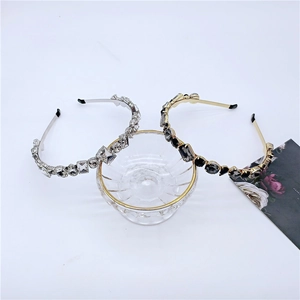 Detail view of luxurious rhinestone headbands in silver and gold with crystal geometric accents