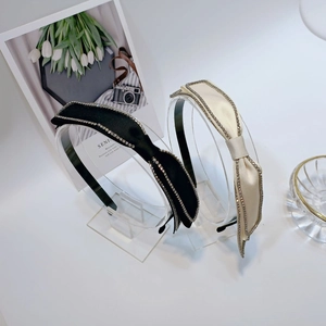 Elegant satin bow headband set with rhinestone edges in black and beige colors