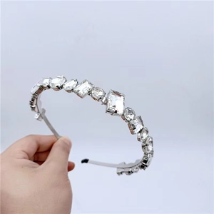 Luxurious silver headband with mixed cut crystals and sparkling rhinestone clusters