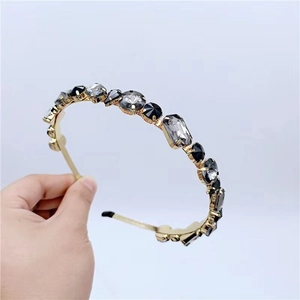 Luxury gold headband for women featuring oversized grey and black multifaceted crystals