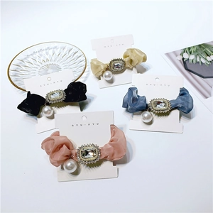 Elegant satin scrunchies with crystal rhinestones and pearl pendants in four colors