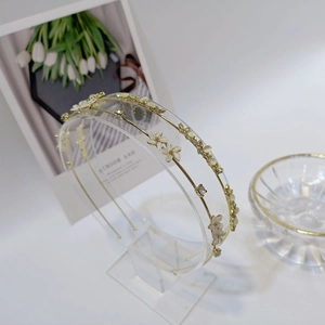 Elegant gold double-layered headband with white flowers and sparkling pearl accents