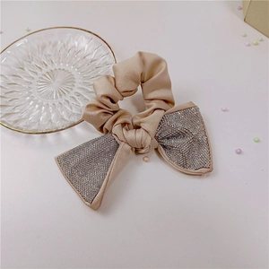 Elegant champagne bow hair scrunchie with sparkling rhinestones for women
