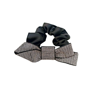 Elegant black satin scrunchie featuring a large sparkling rhinestone bow hair tie accessory