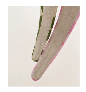 Detailed macro view of checkered sponge headbands with non-slip velvet lining and fine stitching