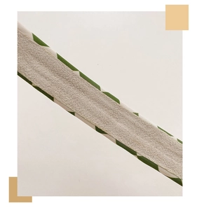 Detailed macro view of the premium green checkered fabric and non-slip suede texture