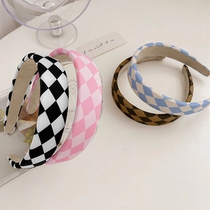 Detail of candy-colored checkered fabric headbands in black, pink, blue, and brown tones