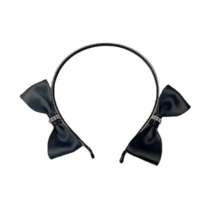 Elegant black satin headband with double bows and sparkling rhinestones on white backdrop