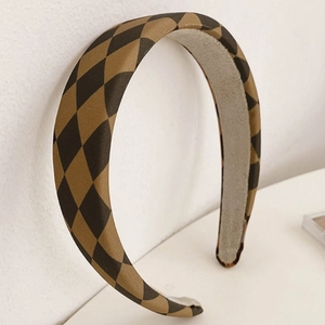 Brown and black checkered fabric headband with glossy satin finish and wide sponge design