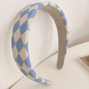 Detail of blue and white checkered sponge headband with anti-slip inner fabric