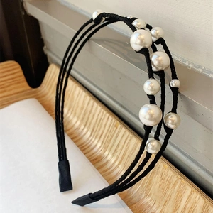 Elegant triple-layered vintage pearl headband with white beads on black metal frame
