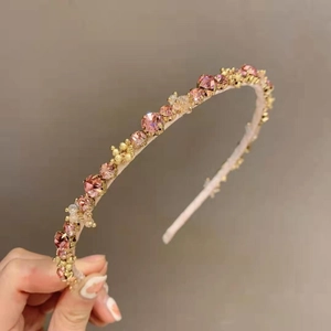 Elegant gold headband featuring pink crystals and rhinestones for weddings and parties