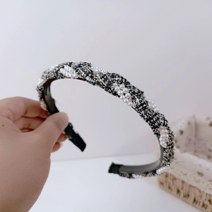 Elegant tweed headband with white faux pearls in classic black and white style