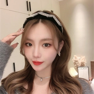 Close-up of velvet headband with crystal diamond lattice pattern on female model