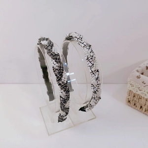 Elegant tweed twisted headband with pearls in black, white, and grey color options