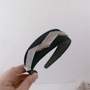 Elegant black velvet headband with sparkling silver rhinestone wave patterns