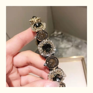 French vintage style headband with clock dial ornament and black rhinestones