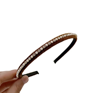 Brown velvet headband with artificial pearls and rhinestones shown on a white background