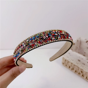 Luxury wide headband with colorful rhinestones and gold bead chain on a black base