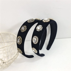 Macro detail of black velvet baroque headband with sparkling vintage crystal embellishments