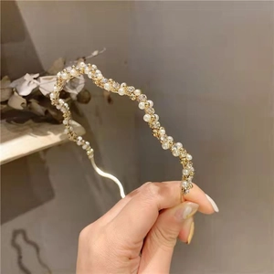 Elegant gold wavy headband featuring white pearls and rhinestones for French style hairstyles