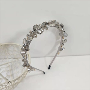 Close-up of grey crystal headband showing intricate hand-stitched smoky beads