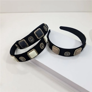 Detailed view of Baroque black velvet headbands with vintage gemstones and rhinestones