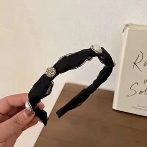 Elegant mesh headband with white pearls and rhinestones on black fabric for women