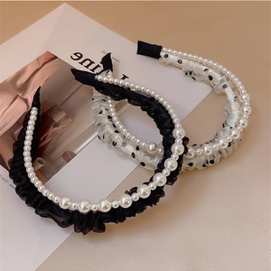 Detailed close-up of French vintage pearl headbands with mesh veils and elegant textures