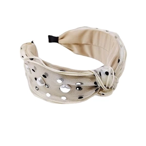 Elegant beige polka dot headband with knot detail and pearls for women hair styling
