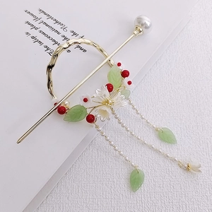 Detailed view of elegant gold hair stick with pearls and long tassels for Hanfu hairstyle
